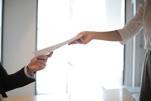 people exchanging document